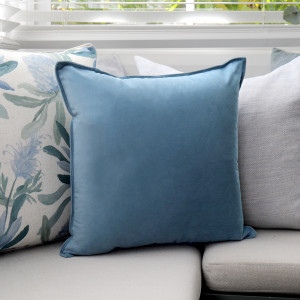 Aegean Blue Velvet Cushion, shown as a soft decorative accent for layering on seating or a bed