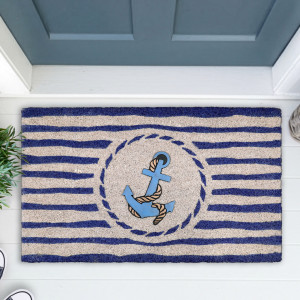 Close view of navy striped coir doormat with a blue anchor and rope motif at a blue-grey door