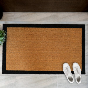 Carlton XL Black Border Doormat - 115x70cm - Vinyl Backed, presented as a decorative entrance mat for the front doorway
