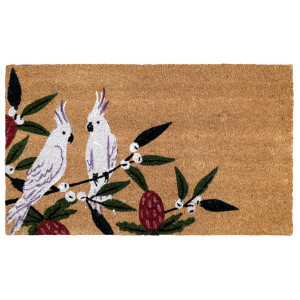 Rectangular natural coir doormat featuring two white cockatoos on leafy branches with burgundy blossoms