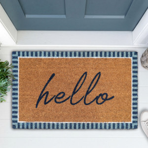 Coir doormat with navy hello lettering and a blue striped border beside a blue front door