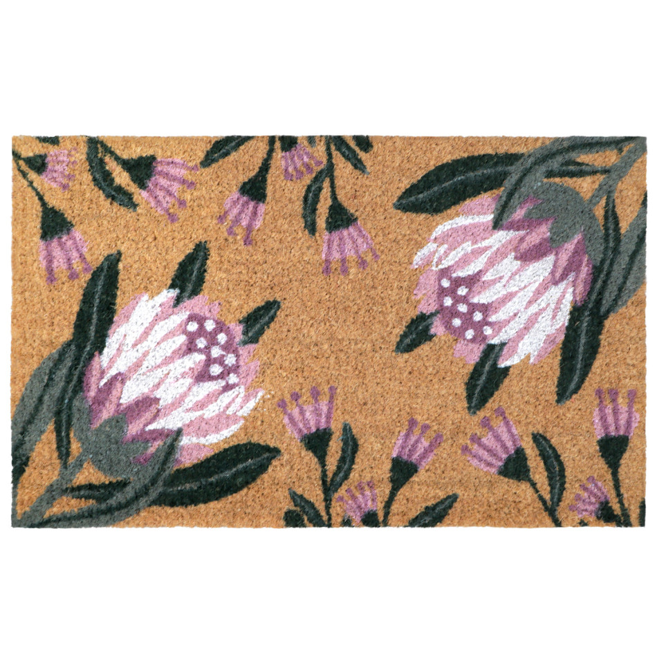 Rectangular coir doormat with two pink proteas, smaller flowers and deep green foliage on a white background