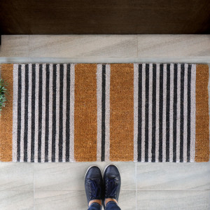 Porter striped coir doormat positioned across a wide entrance