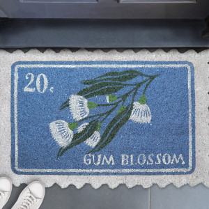 Pippa Blue Postage Stamp Doormat 80x50cm, presented as a decorative entrance mat for the front doorway