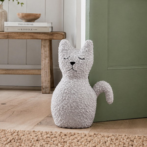 Oscar the Cat Door Stop, a decorative floor accent made to keep a door securely positioned