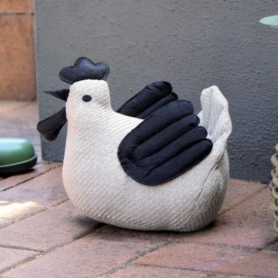 Lottie the Chicken Door Stop, a functional accent designed to hold a door in place