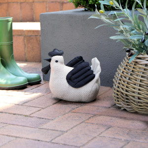 Lottie the Chicken Door Stop, a decorative floor accent made to keep a door securely positioned