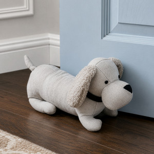Alfie Oatmeal Beige Dog Door Stop, designed as a practical door holder with a characterful decorative form