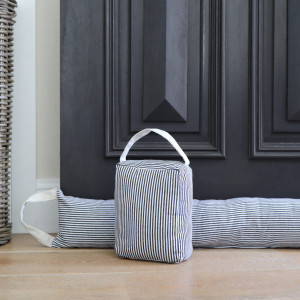 Classic Ticking Stripe Door Stop, a decorative floor accent made to keep a door securely positioned