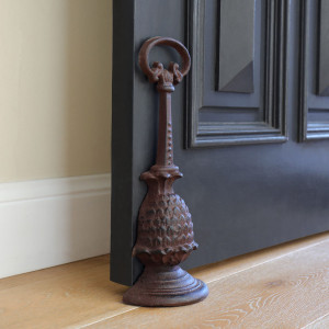 Tall Pineapple Door Wedge with Handle - Antique Brown, a decorative floor accent made to keep a door securely positioned