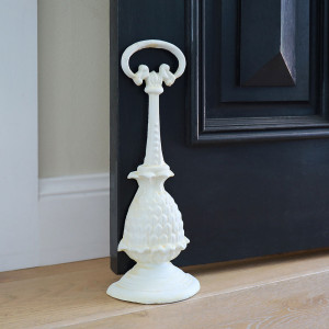 Tall Pineapple Doorstop - Antique White, a decorative floor accent made to keep a door securely positioned
