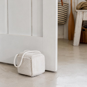 Skipper White Rope Doorstop, a decorative floor accent made to keep a door securely positioned