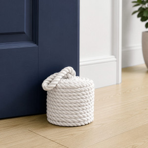 Bowline White Rope Doorstop, a decorative floor accent made to keep a door securely positioned