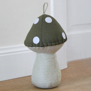Khaki Green Toadstool Door Stop, a functional accent designed to hold a door in place