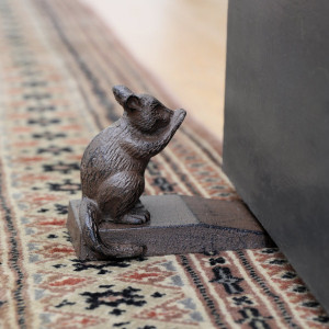 Clancy the Possum Door Wedge, a decorative floor accent made to keep a door securely positioned