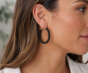 Black Blair Raffia Hoop Earrings, a jewellery piece designed as a decorative personal accessory