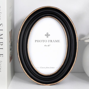Oval black and antique gold 4x6 photo frame shown against a white background.