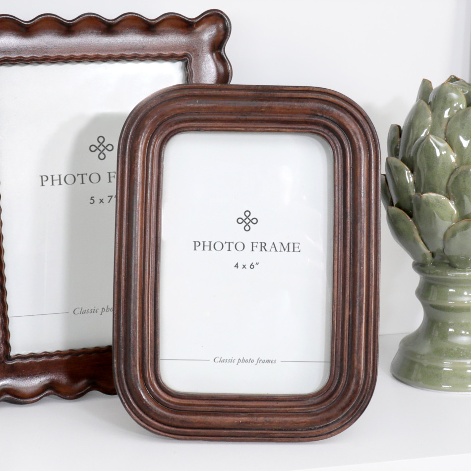 Orleans chestnut photo frame with rounded corners and layered ribbed detailing displayed beside a coordinating frame.