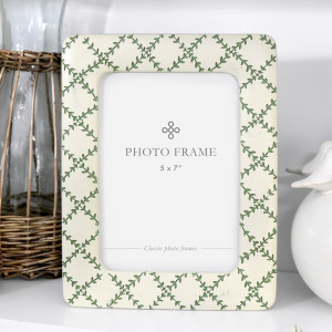 Cream 5x7 photo frame with a soft green leafy lattice pattern and rounded corners.