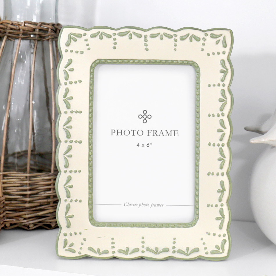 Cream and soft sage green 4x6 photo frame with scalloped edges, raised leaf details and dotted accents.