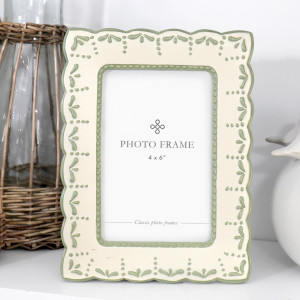 Cream and soft sage green 4x6 photo frame with scalloped edges, raised leaf details and dotted accents.