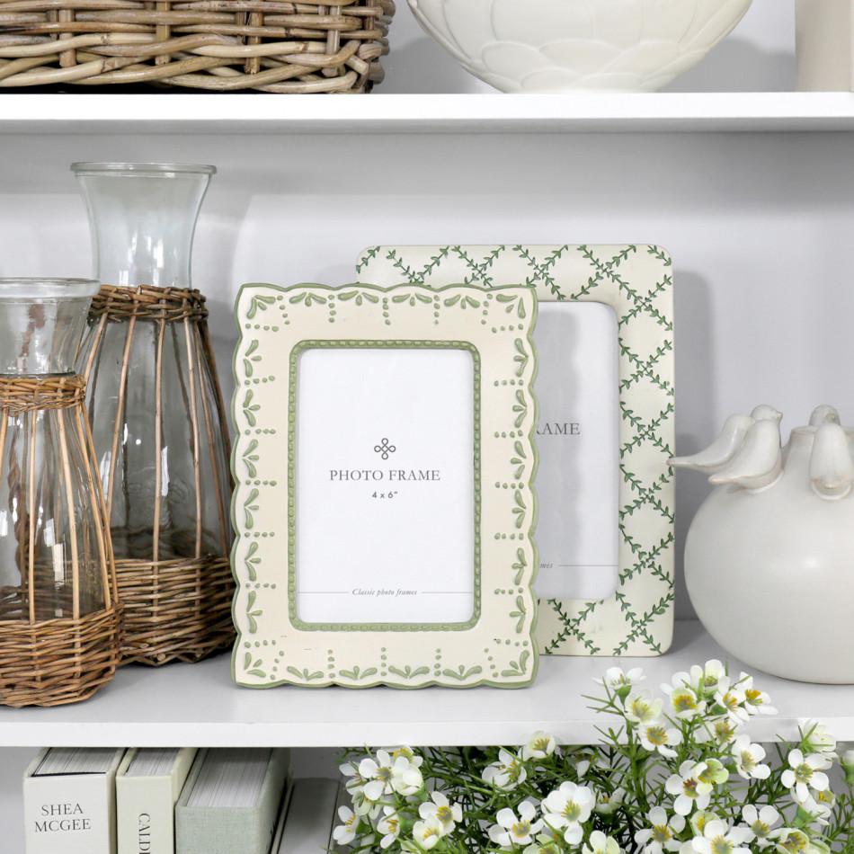 Juniper Floral 4x6 photo frame styled with the coordinating Juniper Lattice 5x7 frame, wicker glass jugs and white ceramic décor on a shelf.