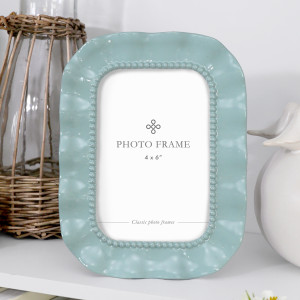 Aqua blue 4x6 photo frame with a ruffled edge and raised beaded inner border.