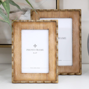 Marielle 4x6 inch wood frame in front of the matching 5x7 inch frame, showing their scalloped borders