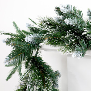 Close-up of Santa Lucia garland showing mixed green pine foliage and white frosted tips.
