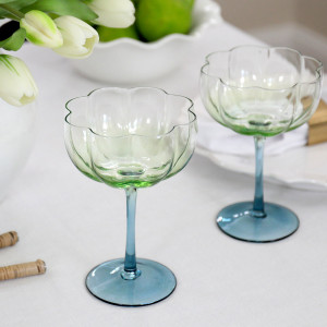 Set 4 Capri Fluted Coupe Glasses, a practical vessel for drinks with decorative tabletop appeal
