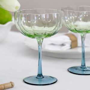 Set 4 Capri Fluted Coupe Glasses, a drinkware piece designed for serving beverages at the table