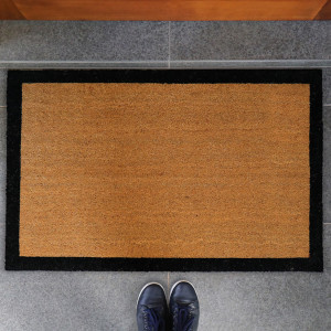 Harford black border coir doormat styled at a wide entrance