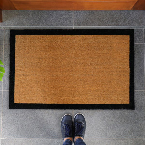 Large natural coir doormat with a contrasting black border