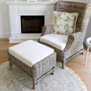 Highbury footstool and coordinating rattan armchair in a living room