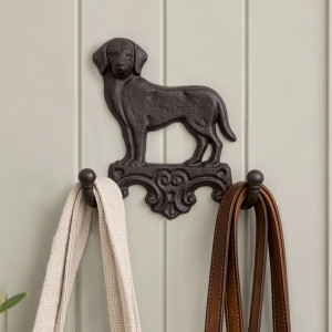 Dark brown cast iron Labrador wall hook holding a cream bag and brown dog leads