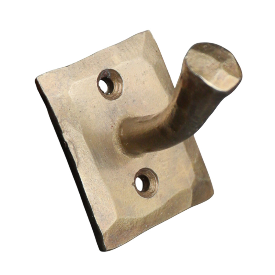 Angled product view of the gold nail wall hook with a rectangular plate and two mounting holes