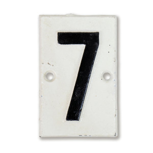 White cast iron Lambeth house number plaque with black numeral 7 and two mounting holes