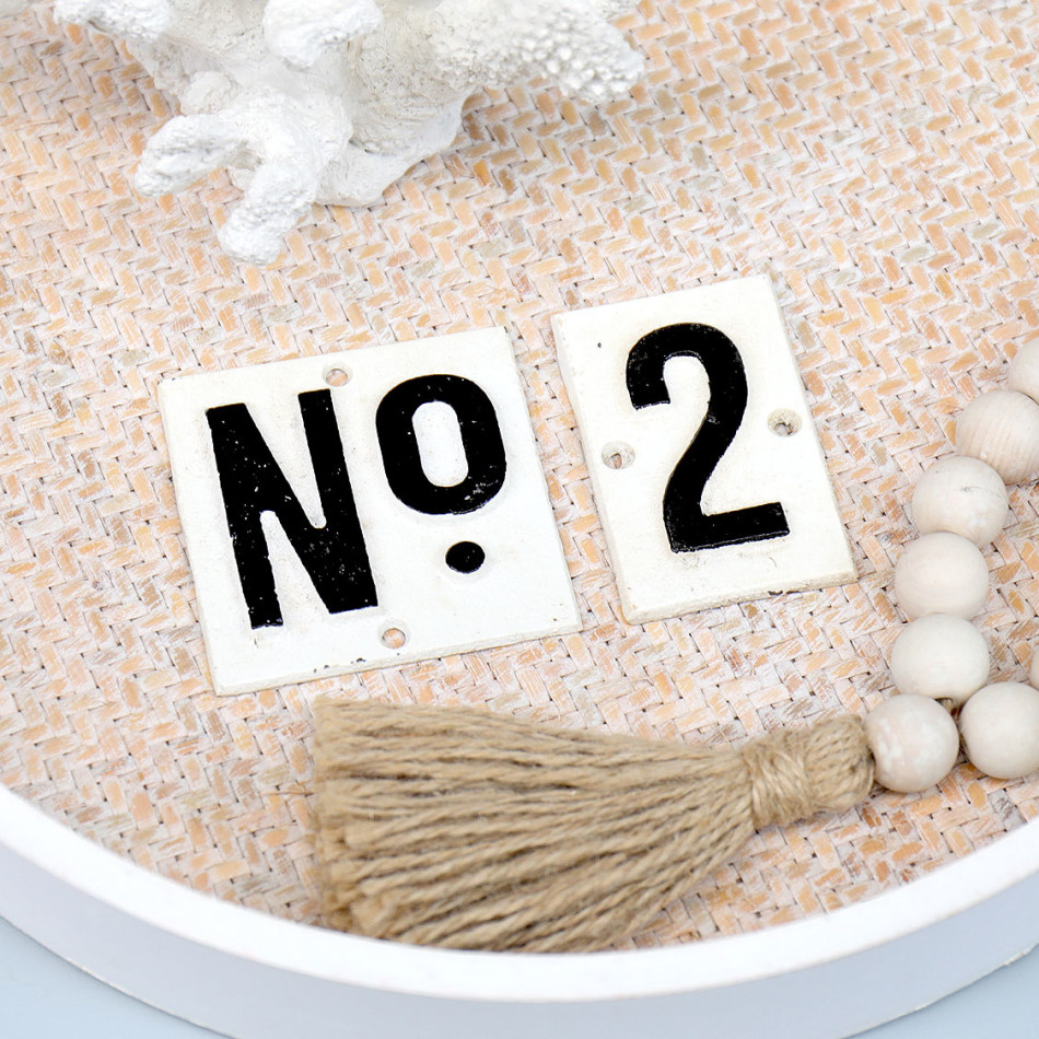 Vintage cast iron number signs displaying number 2 in black