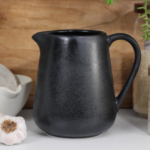 Black reactive-glaze ceramic Bistrot jug styled on a kitchen bench.