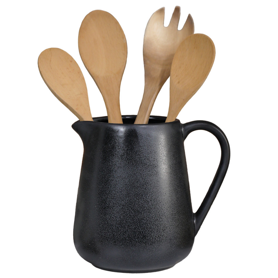 Black ceramic Bistrot jug used as a utensil holder with wooden cooking utensils.