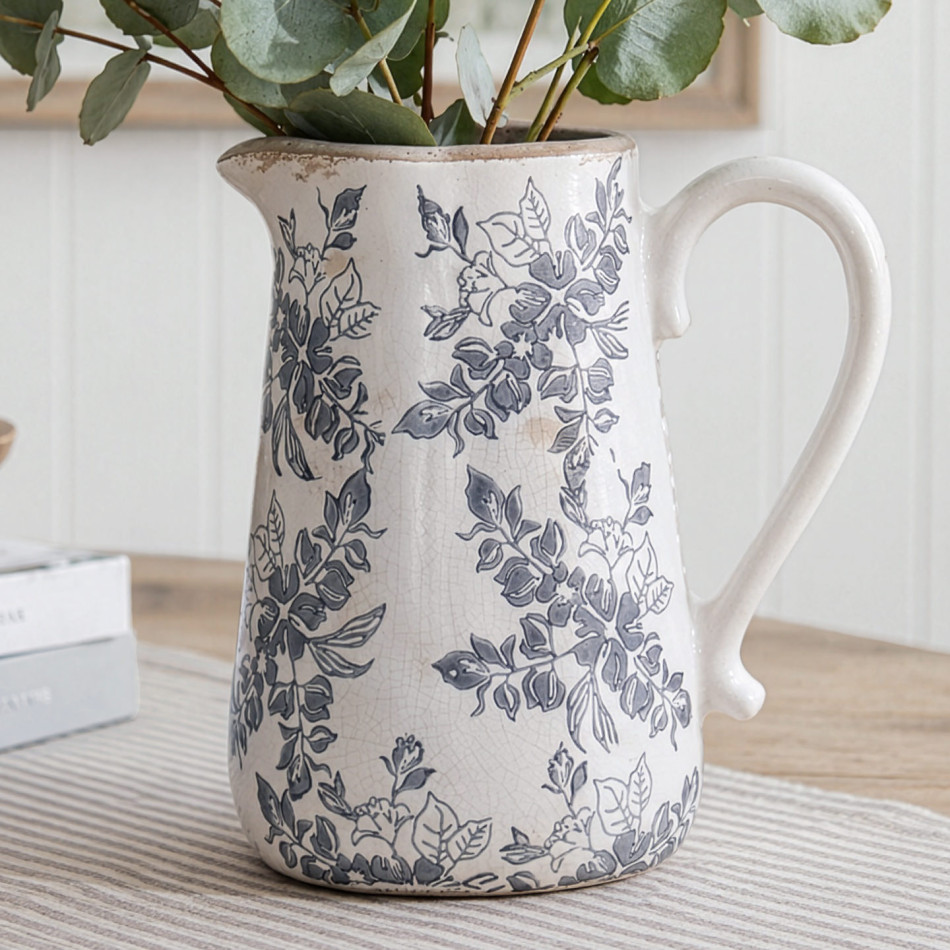 Norwood grey floral ceramic jug filled with eucalyptus and styled on a striped runner