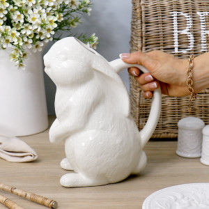 Side view of the glazed rabbit jug showing its sculpted fur