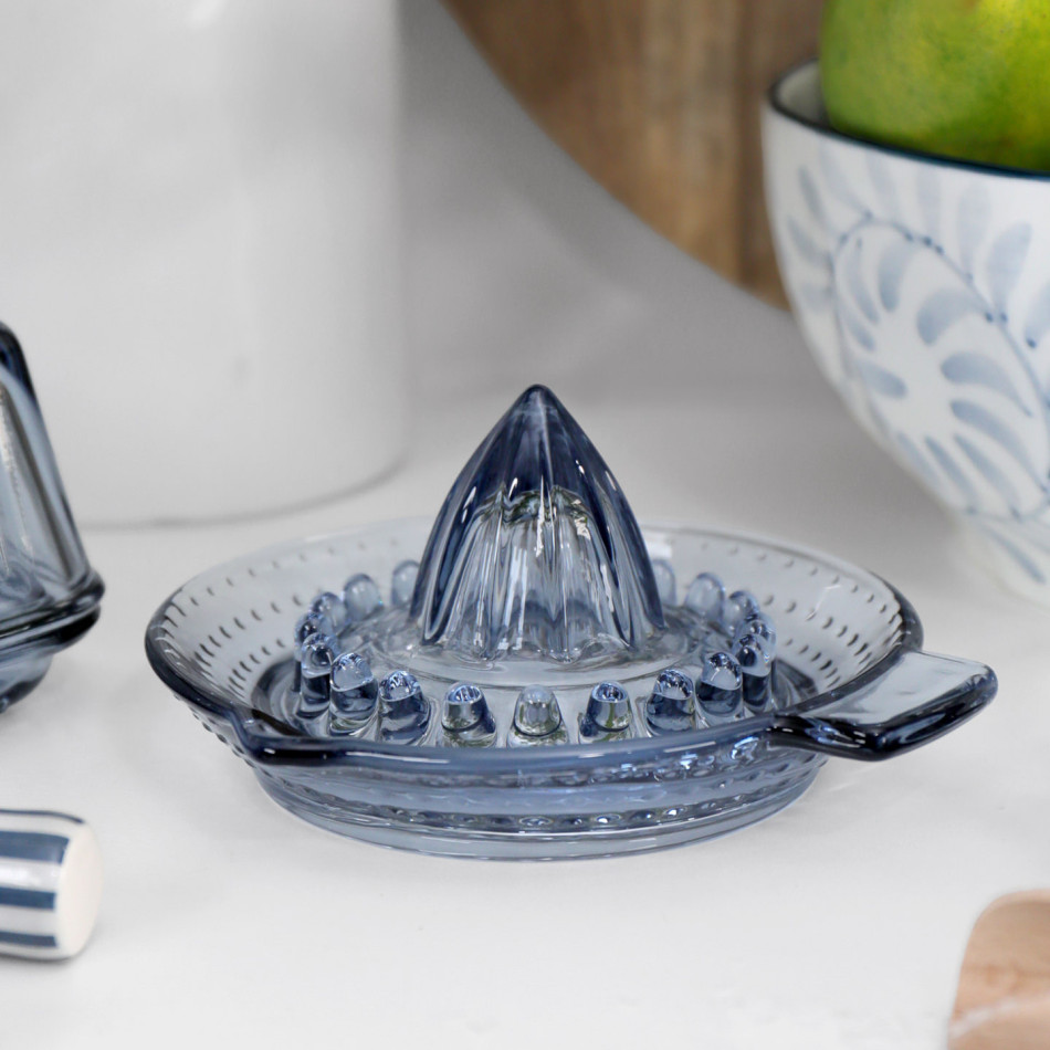 Heritage Blue Glass Juicer styled on a white kitchen bench with coordinating blue glassware