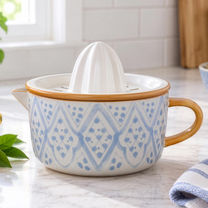 Rosecroft blue and white ceramic citrus juicer with ochre trim styled on a kitchen bench