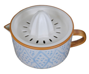 Angled top view showing the ceramic reamer, strainer slots, handle and pouring spout