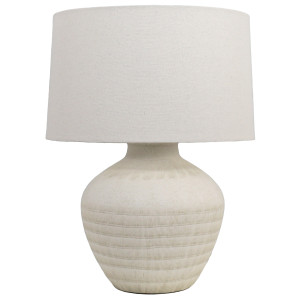 Fernando cream ceramic table lamp with rounded textured base and off-white linen shade on a white background