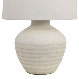 Close-up of the Fernando lamp’s cream ceramic base with horizontal bands of fine textured dashes