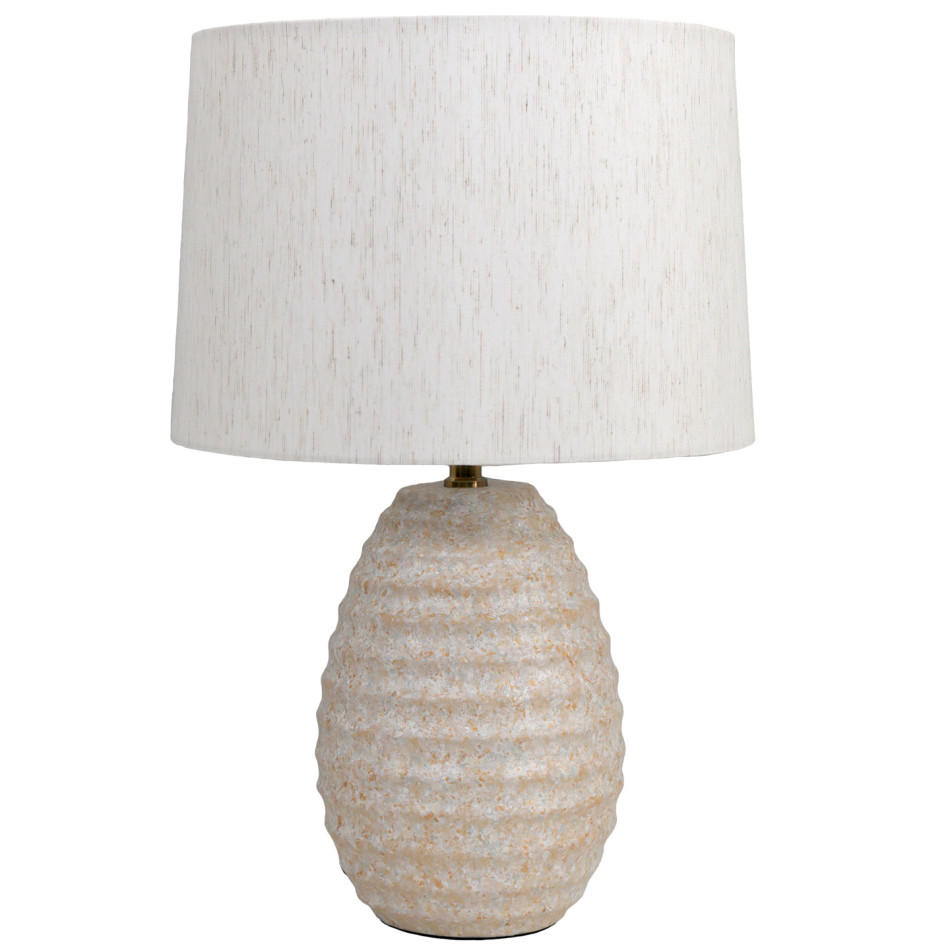 Lopez table lamp with a sandy beige rippled ceramic base and off-white linen shade against white
