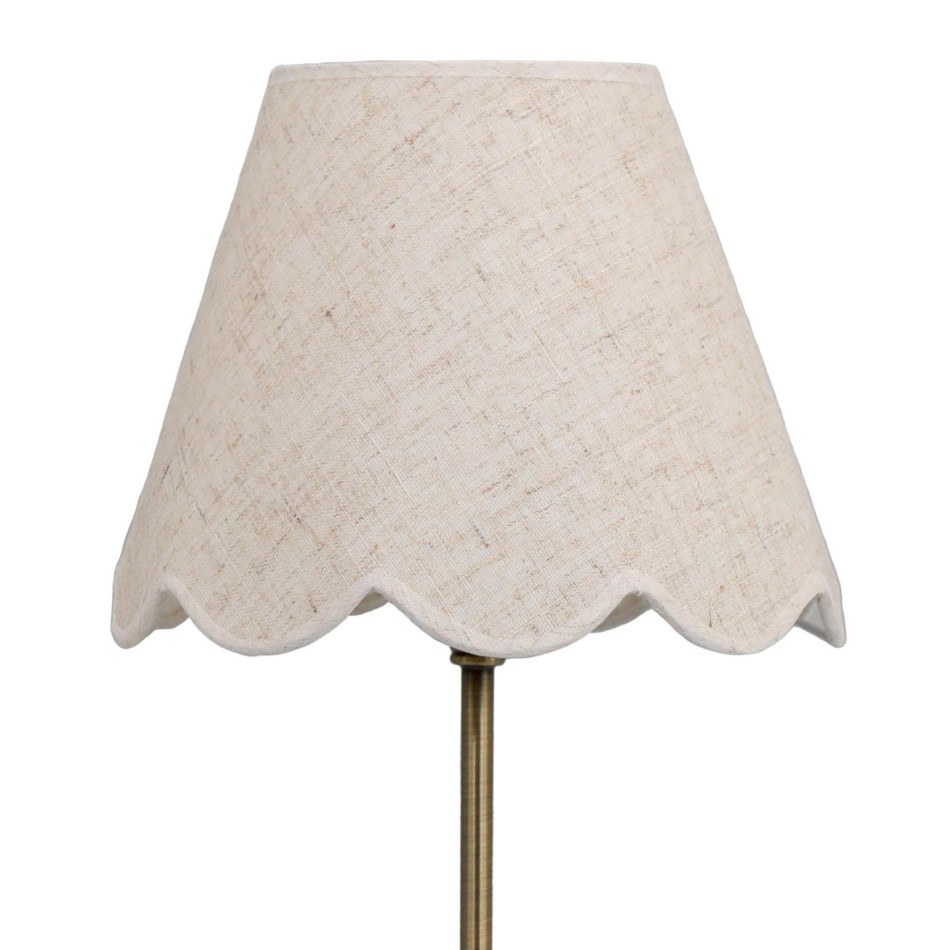 Close-up of the Claudia lamp’s off-white linen shade with a scalloped lower edge