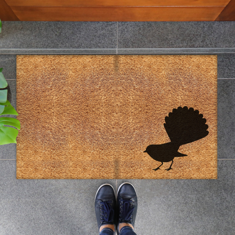 Natural coir doormat with a black Willy Wagtail silhouette in the lower corner